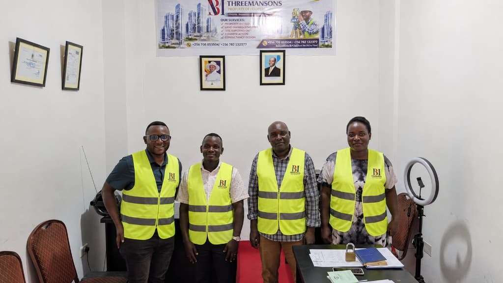 The THREEMANSONS office team in branded safety vests